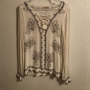 This is a hand beaded blouse from Idyllwind size large.
